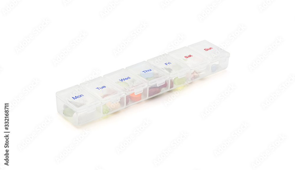 Close up on compartments pill case with clip lids medicine. Organizer tablet storage weekly box container. Daily vitamins and supplements dosage routine concept. Isolated on white with clipping path.