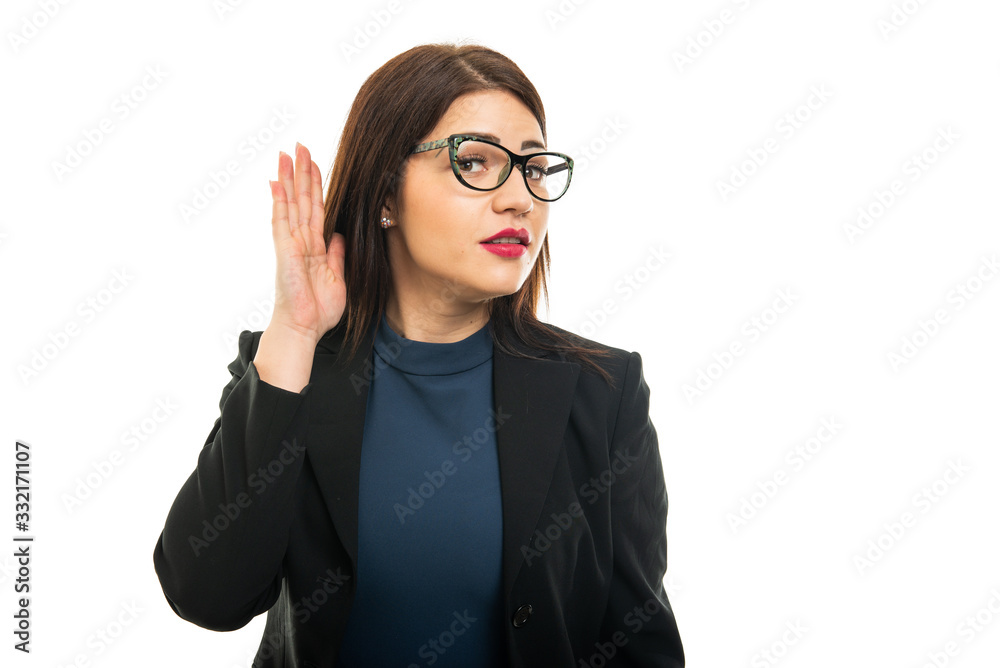 Portrait of young business girl making can't hear gesture
