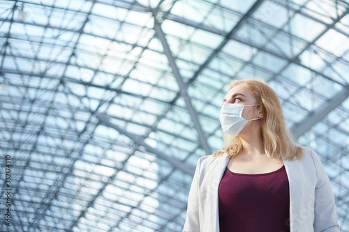 business woman standing in medical mask