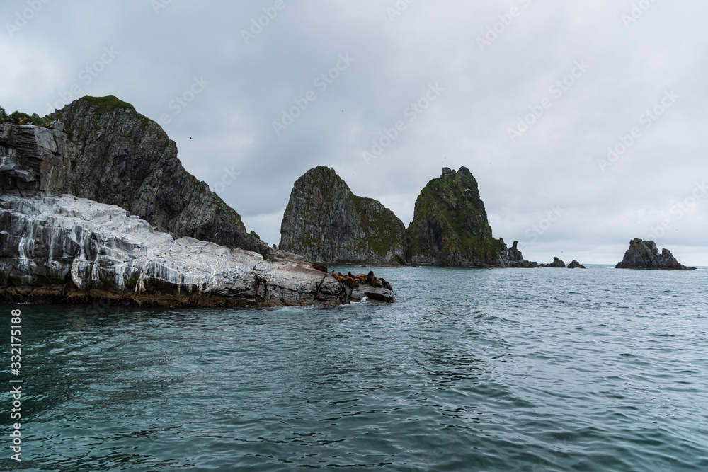 Scenic high rocks in the Pacific Ocean. Kamchatka Peninsula.