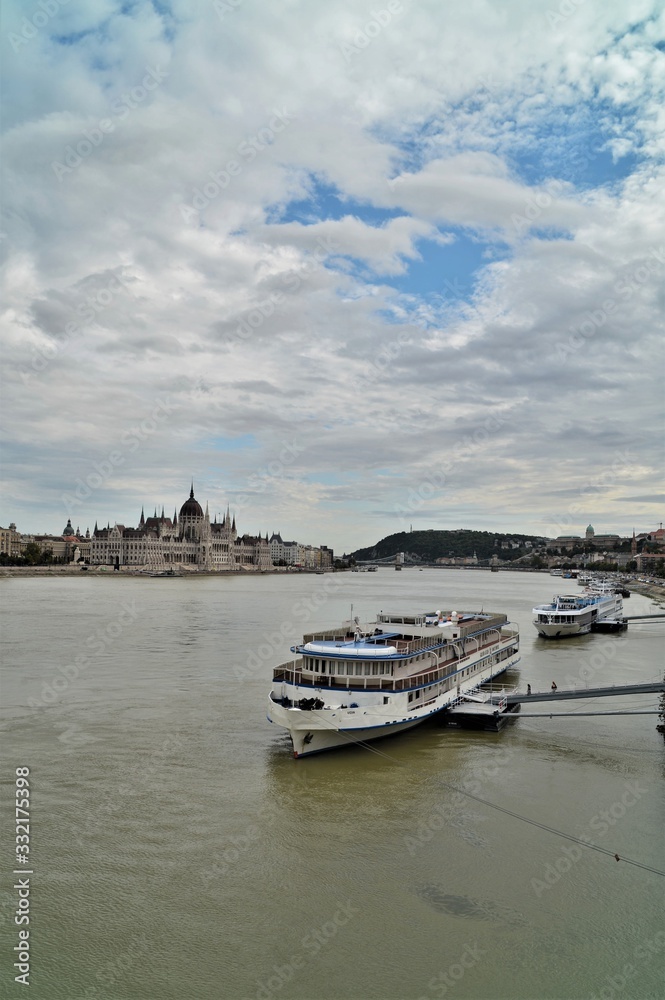 the parliament in budapest in hungary with the danube and river cruise ships