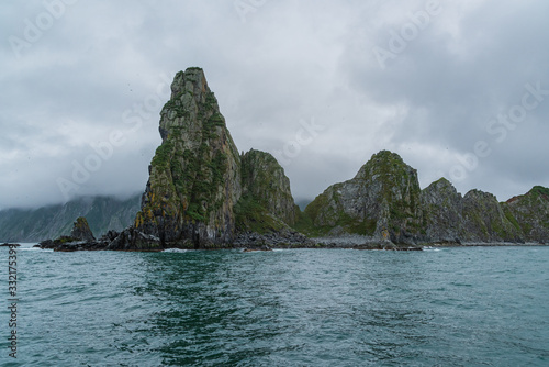 Scenic high rocks in the Pacific Ocean. Kamchatka Peninsula.