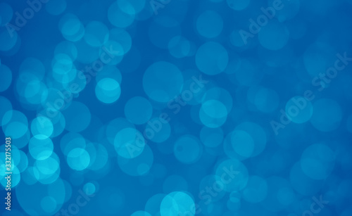 abstract blue bokeh glitter sparkle background.