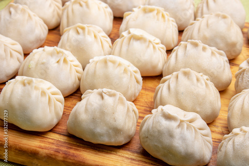 Manti or manty dumplings, popular asian dish on board