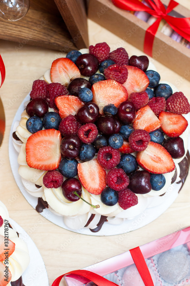 Pavlova cake with fresh strawberries, cherries, blueberries and raspberries. Pavlova cake with fresh strawberries, cherries, blueberries and raspberries.