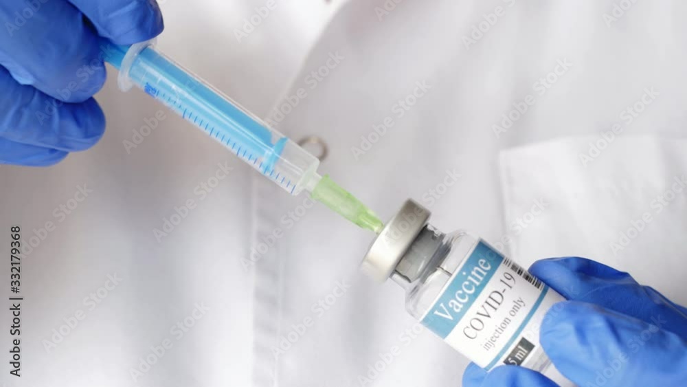doctor draws vaccine to syringe, vial, covid-19, coronavirus ampoule, injection doctor draws vaccine to syringe, vial, covid-19, coronavirus ampoule, injection