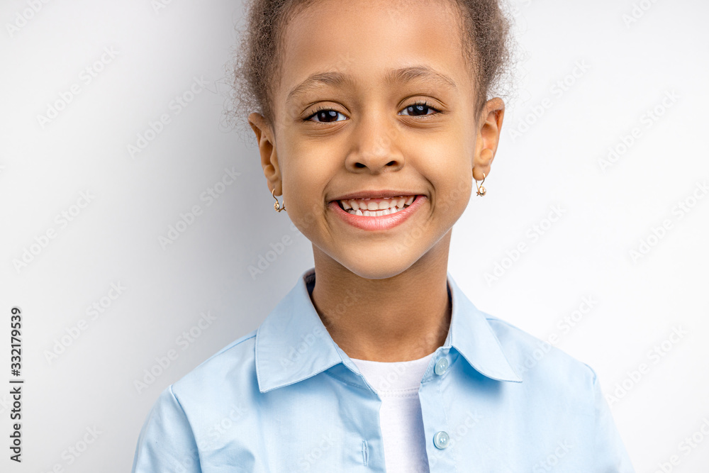 close-up portrait of an adorable, awesome girl isolated on white background, look at camer and smile. copy space. children and people concept close-up portrait of an adorable, awesome girl isolated on white background, look at camer and smile. copy space. children and people concept