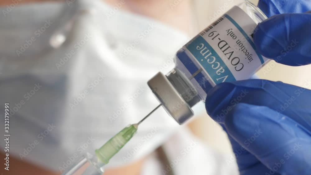 doctor draws vaccine to syringe, vial, covid-19, coronavirus ampoule, injection doctor draws vaccine to syringe, vial, covid-19, coronavirus ampoule, injection