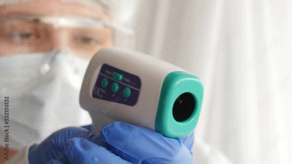 doctor aiming with Non-Contact Forehead Infrared Thermometer like gun, pov doctor aiming with Non-Contact Forehead Infrared Thermometer like gun, pov