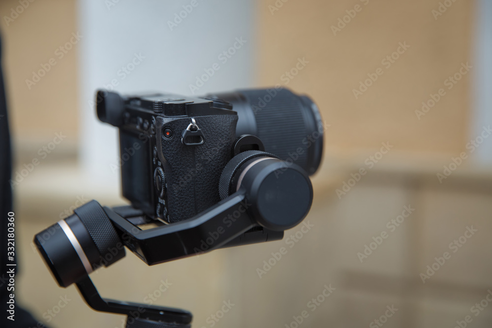 Focus on tripod mounted camera screen showing . Digital equipment recording video . Close up successful man recording video, using digital . Blogger recording vlog video on camera .
