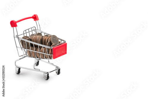 Coins inside of red shopping cart on white background. Isolated with clipping path.