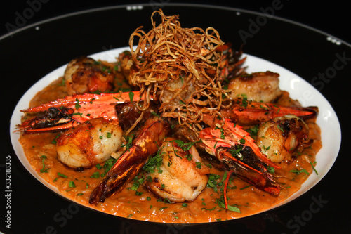 grilled jumbo tiger prawns risotto, Italian rice cooked in rich flavored rock lobster sauce