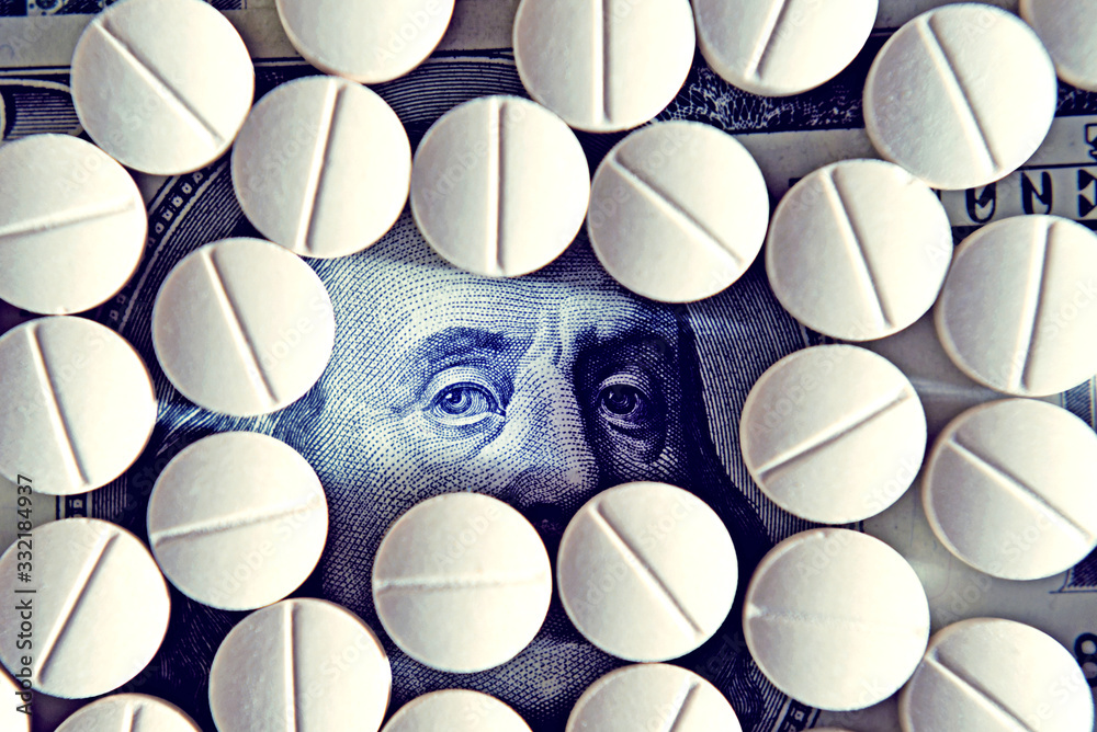 Abstract image with dollar banknote and tablets as a symbol of significant costs and economic downturn during the coronavirus.