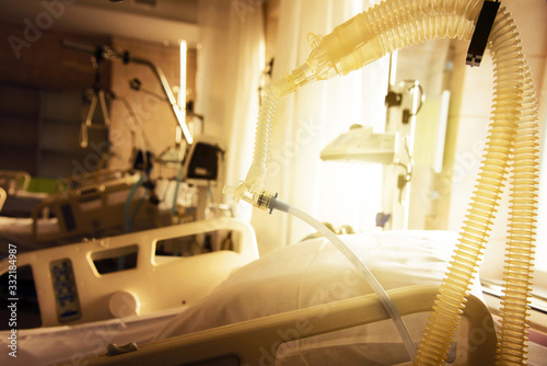 Plastic tube of artificial ventilation apparatus in a modern hospital in the intensive care room. (coronavirus, death, sorrow, hope, salvation - concept) photo