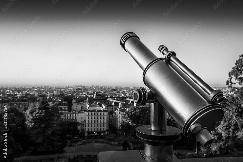 Telescope, view from Montmartre Hill overlooking the rooftops, Paris, France
