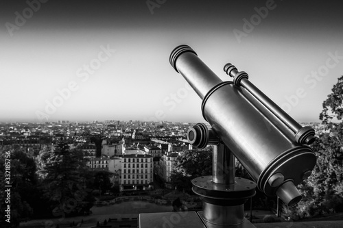 Telescope, view from Montmartre Hill overlooking the rooftops, Paris, France