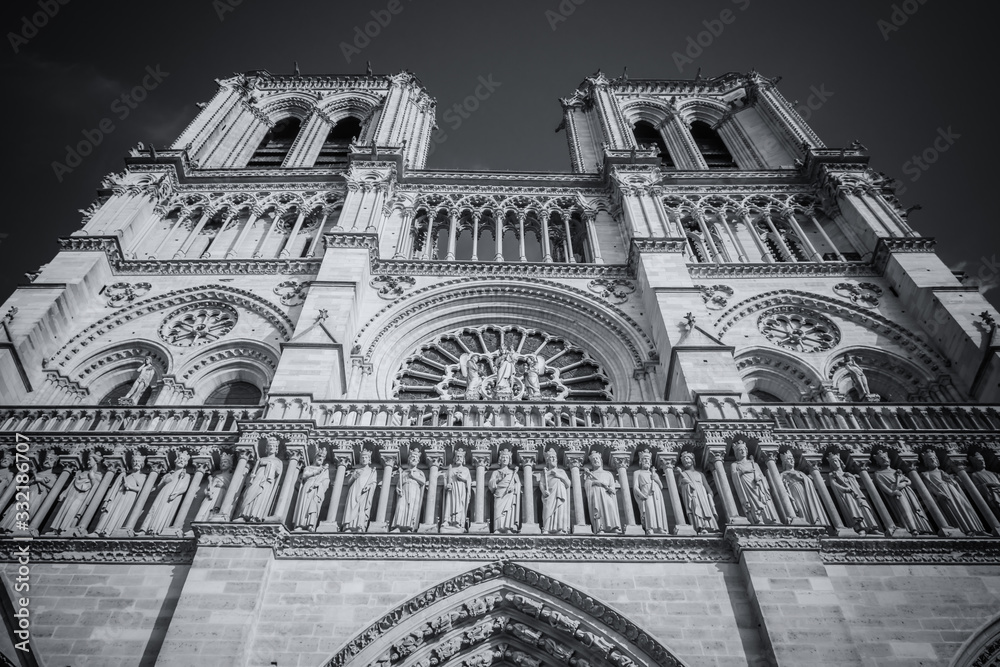 Looking up at the two bell towers of Notre Dame Cathedral, in black and white, Paris, France