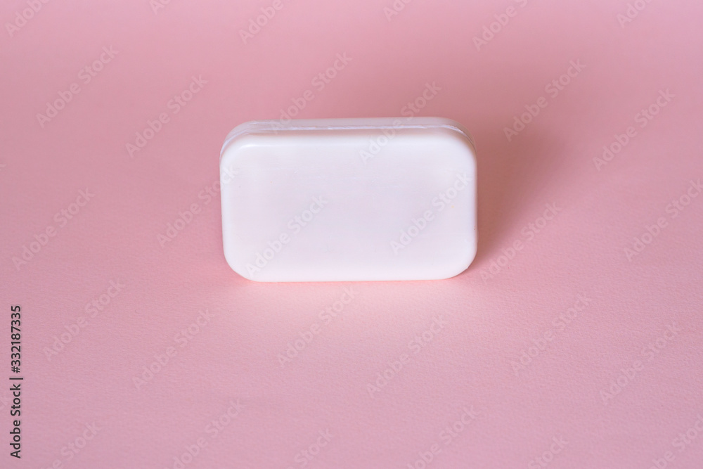 Soap bar in foam with copy space in center isolated on bright pink background. Soap bar in foam with copy space in center isolated on bright pink background.