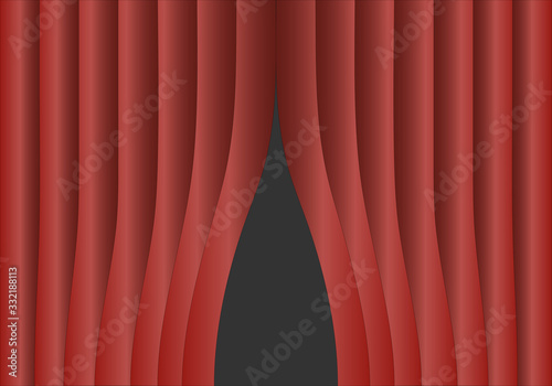 Telón rojo entreabierto de un escenario de un teatro.