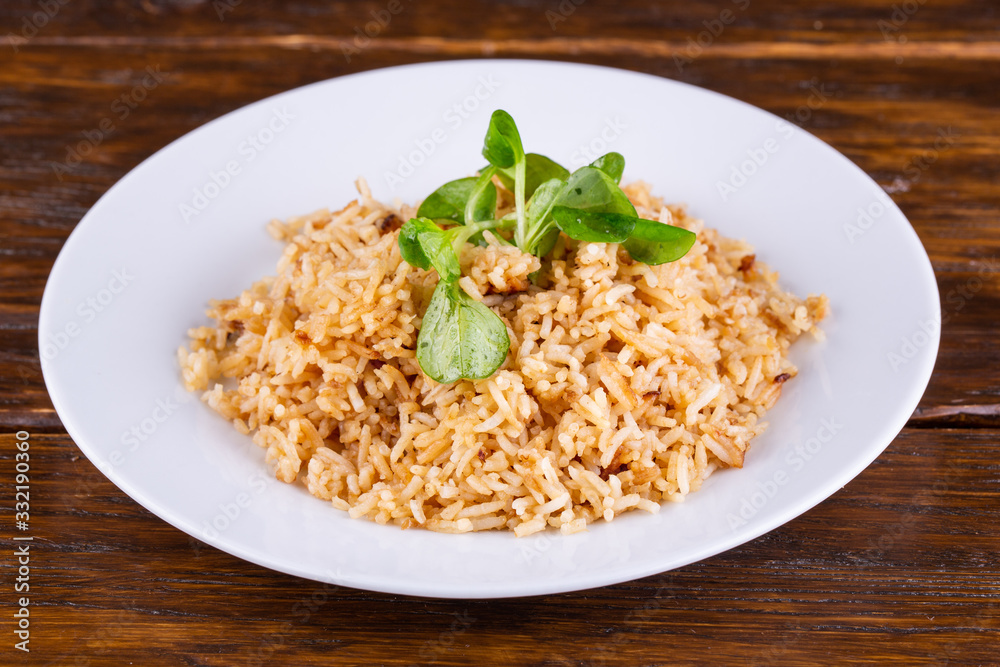 Boiled rice, served with greens and seasonings Boiled rice, served with greens and seasonings