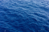 Blue sea water in calm. Clear blue sea - abstract background, wallpaper and texture. selective focus