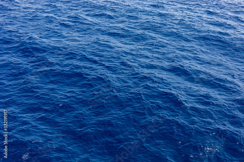 Blue sea water in calm. Clear blue sea - abstract background, wallpaper and texture. selective focus © Andriy Medvediuk