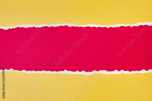 Torn ripped paper edge with a copy space, red and yellow color background