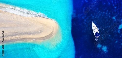 Fototapeta Naklejka Na Ścianę i Meble -  Croatia. Yachts at the sea surface. Aerial view of luxury floating boat on blue Adriatic sea at sunny day. Travel - image