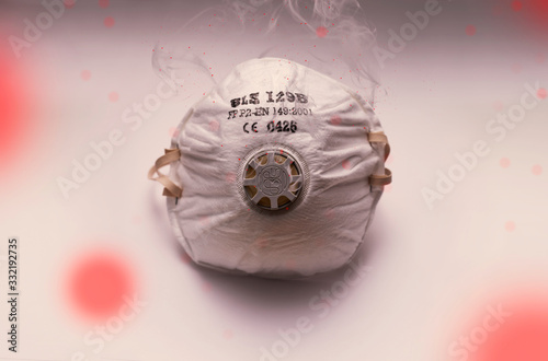 Mask infected with a virus such as coronavirus. Mask shrouded in smoke