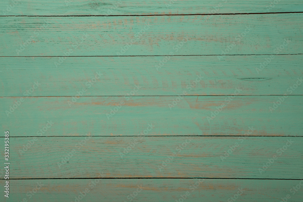 Fototapeta premium Vintage green wood background texture with knots and nail holes. Old painted wood wall. Brown abstract background. Vintage green wooden dark horizontal boards. Front view with copy space. Background f