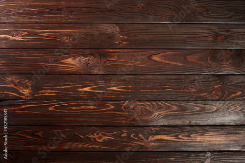 Texture of natural brushed pine board painted in brown