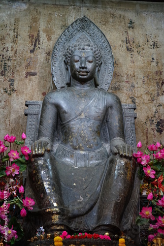  Phra Than Thantharath in temple Na Phra Meru material Carved from green stone Behind the old brown walls