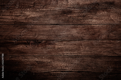 Vintage brown wood background texture with knots and nail holes. Old painted wood wall. Brown abstract background. Vintage wooden dark horizontal boards. Front view with copy space. Background for des