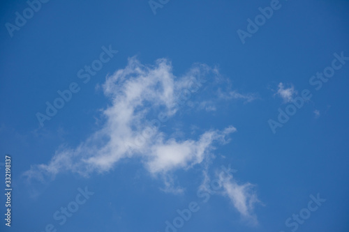 blue sky with horse shape white clouds © Majid Gheidarlou