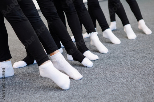 Photo Row of feet ballerina.
