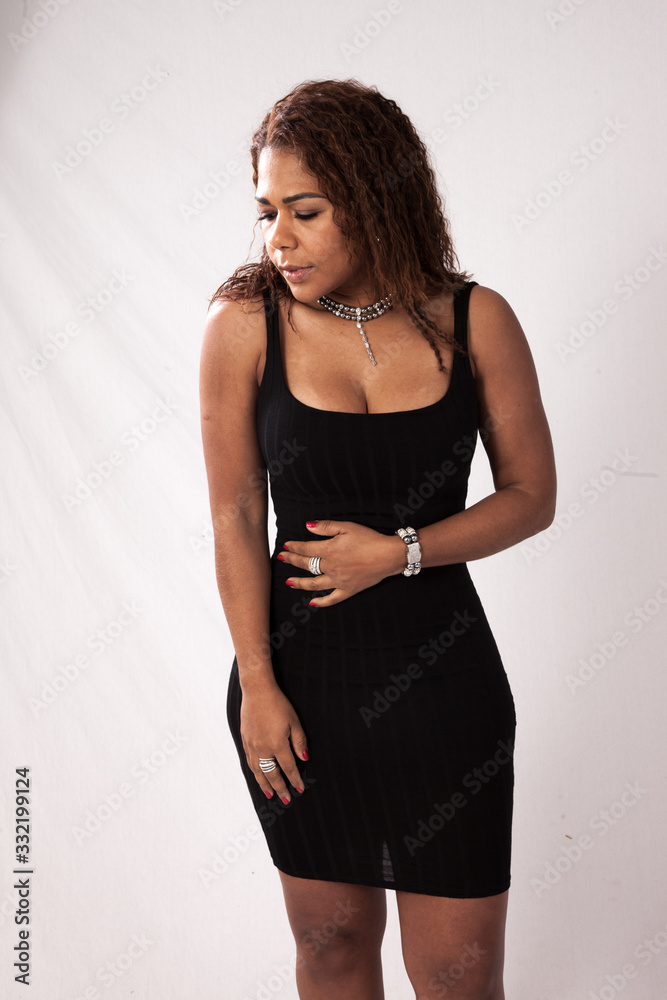 Pensive Hispanic woman in a black blouse Pensive Hispanic woman in a black blouse