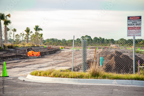 A new road is under construction with several pieces of heavy equipment