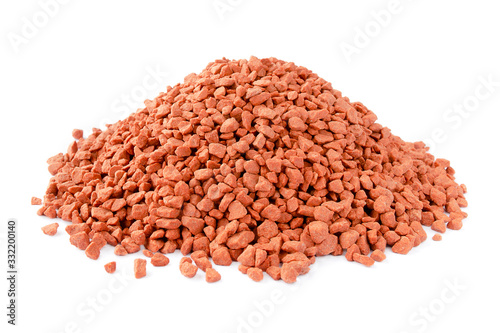 Heap of red mineral fertilizers on a white background. Potassium chloride is isolated on a white background. Granules of mineral fertilizer - potassium chloride. photo