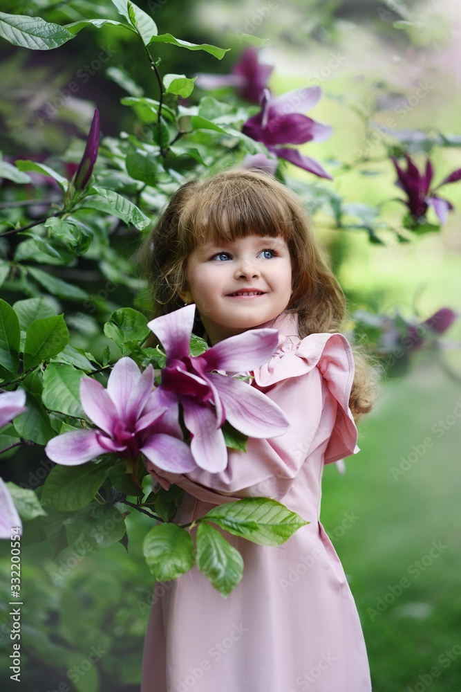 little girl in the garden little girl in the garden