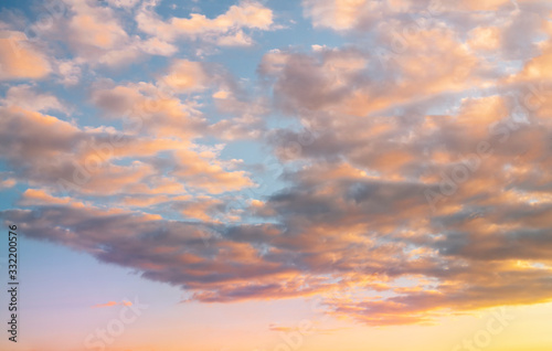 Beautiful colorful bright sunset sky with orange clouds. Nature sky background. 