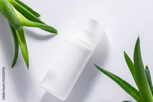 Organic moisturizing cream with Aloe Vera extract on white background close u...