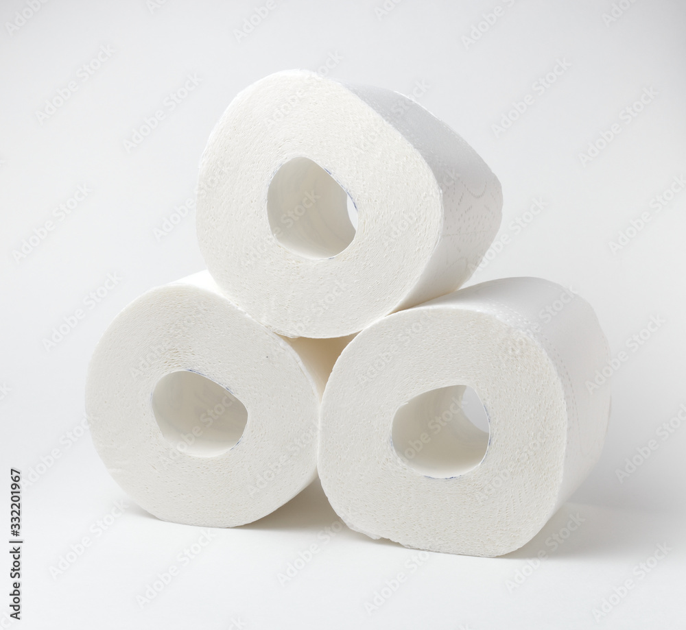 Three toilet paper rolls, very soft hygienic paper on white background. closeup Three toilet paper rolls, very soft hygienic paper on white background. closeup