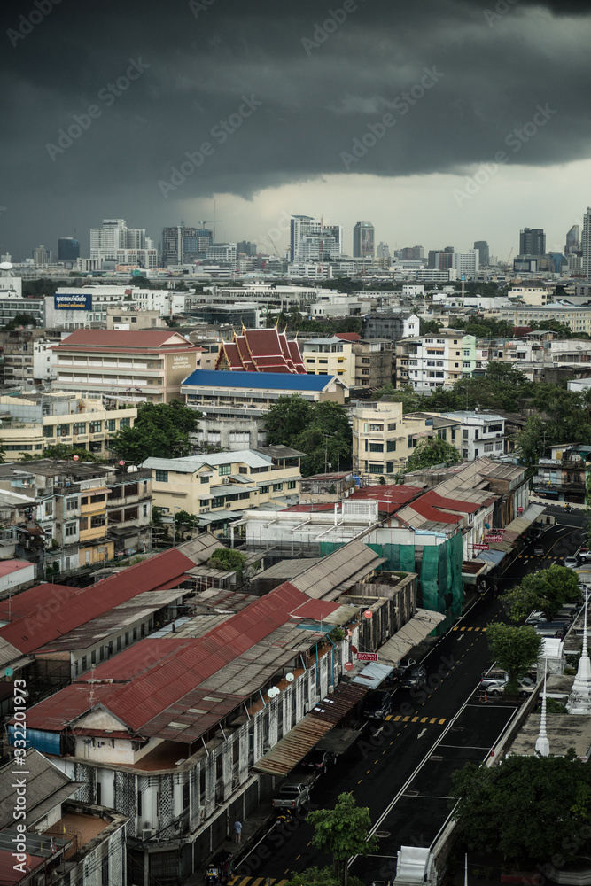 Aerial photo of the city of Bangkok under a grey storm cloud