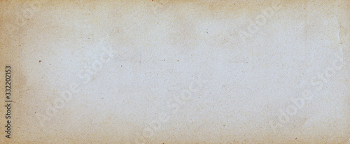 Fotografie Old brown paper parchment background design with distressed vintage stains and i