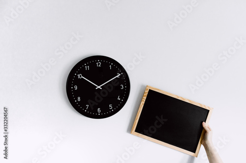 clock and blackboard on white background