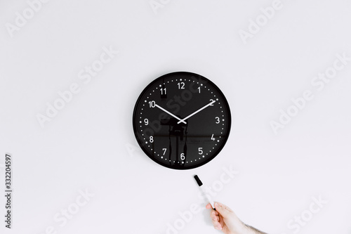 clock isolated on white background and pointing out with marker pen