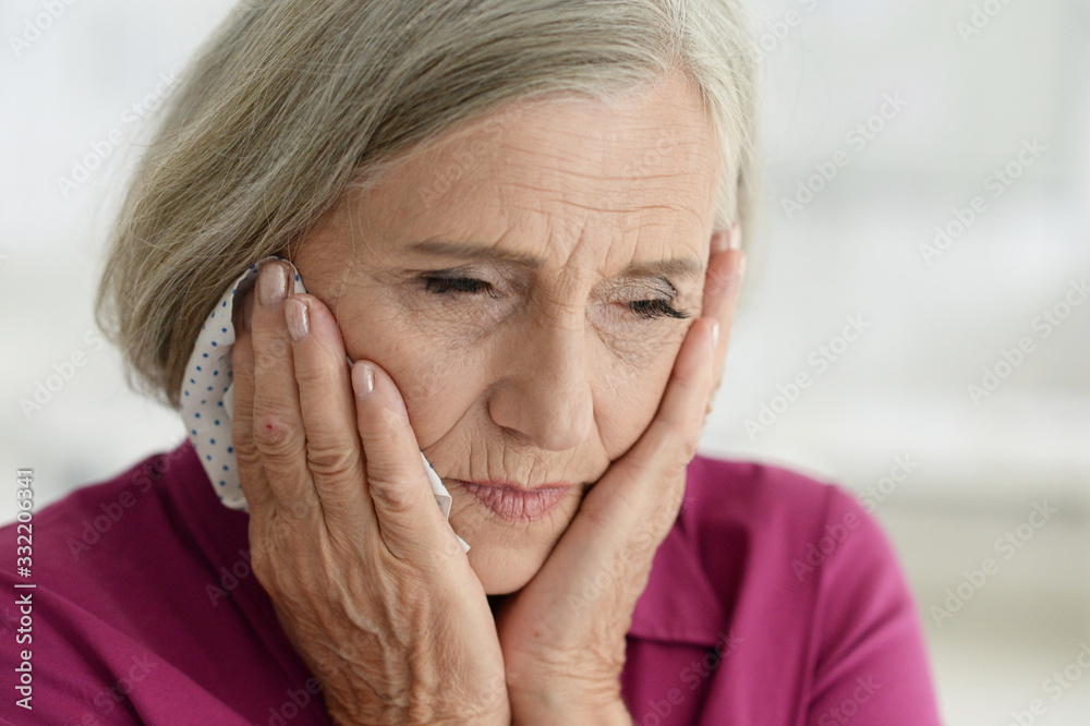 Close up portrait of sad ill senior woman Close up portrait of sad ill senior woman