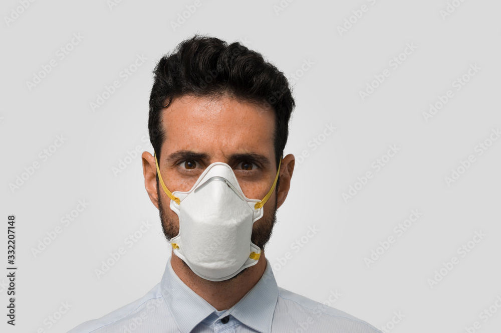 Serious bearded man with a medical face mask Serious bearded man with a medical face mask