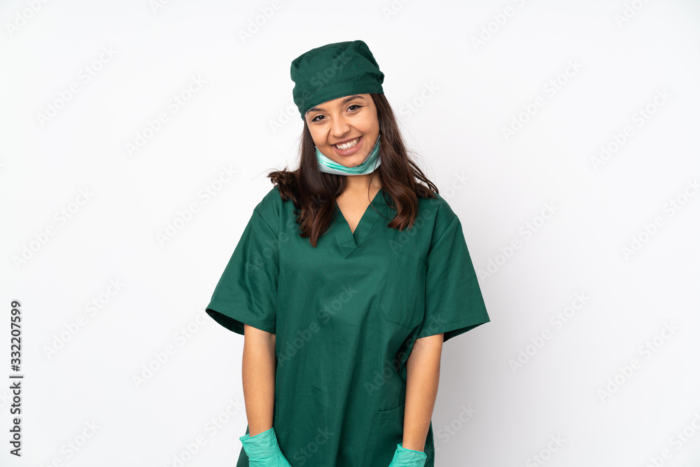 Surgeon woman in green uniform isolated on white background laughing Surgeon woman in green uniform isolated on white background laughing