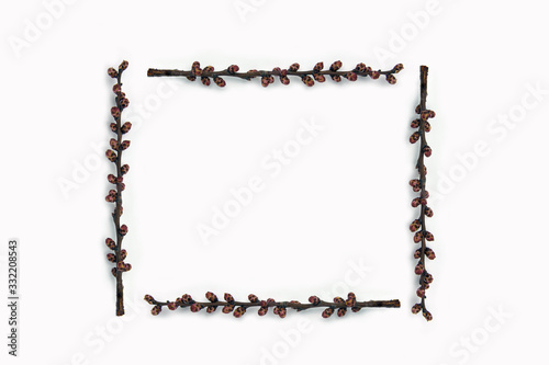 Frame of cherry twigs with buds. Place for text.